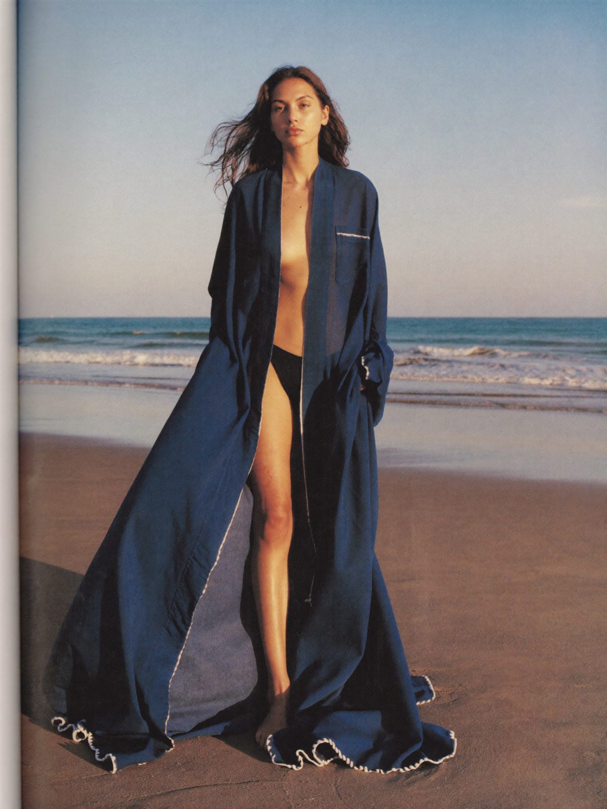 Indigo silk kaftan billowing in sea breeze
